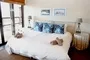 Luxury Accommodation Drakensberg Rainbow Lodge Sani Valley Main Bedroom Bed 2
